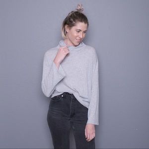 Grey baggy turtleneck. Unmarked size.